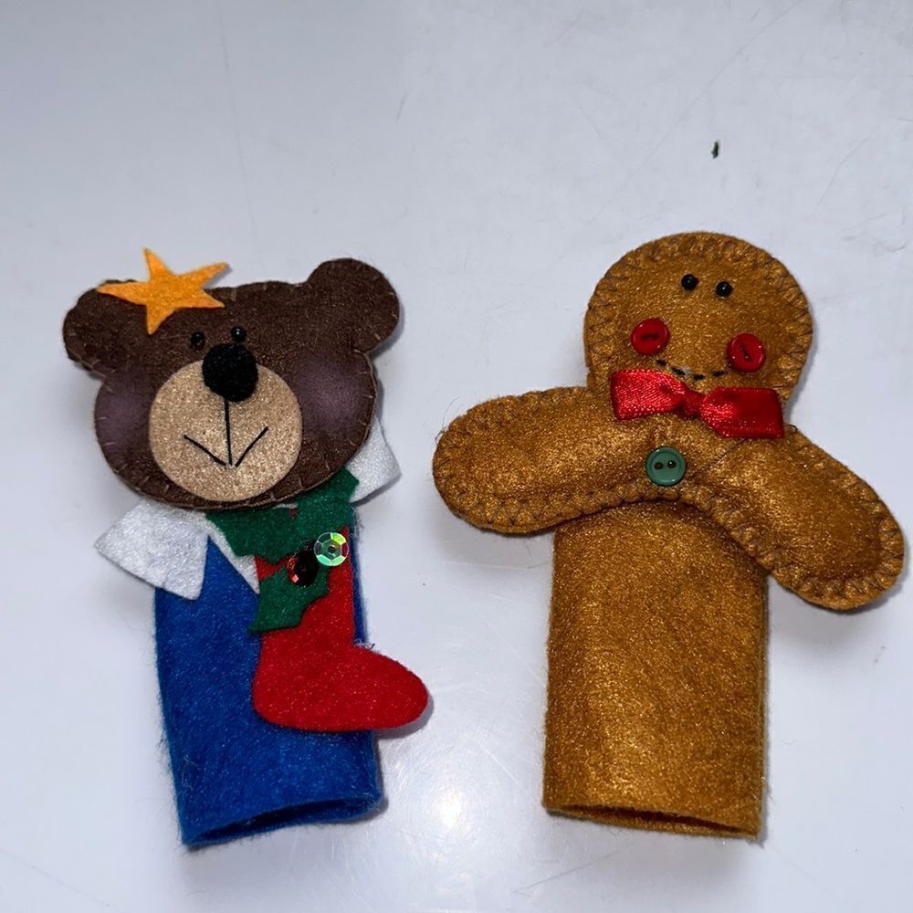 Two Christmas felt finger puppets - a bear with a stocking and a gingerbread man